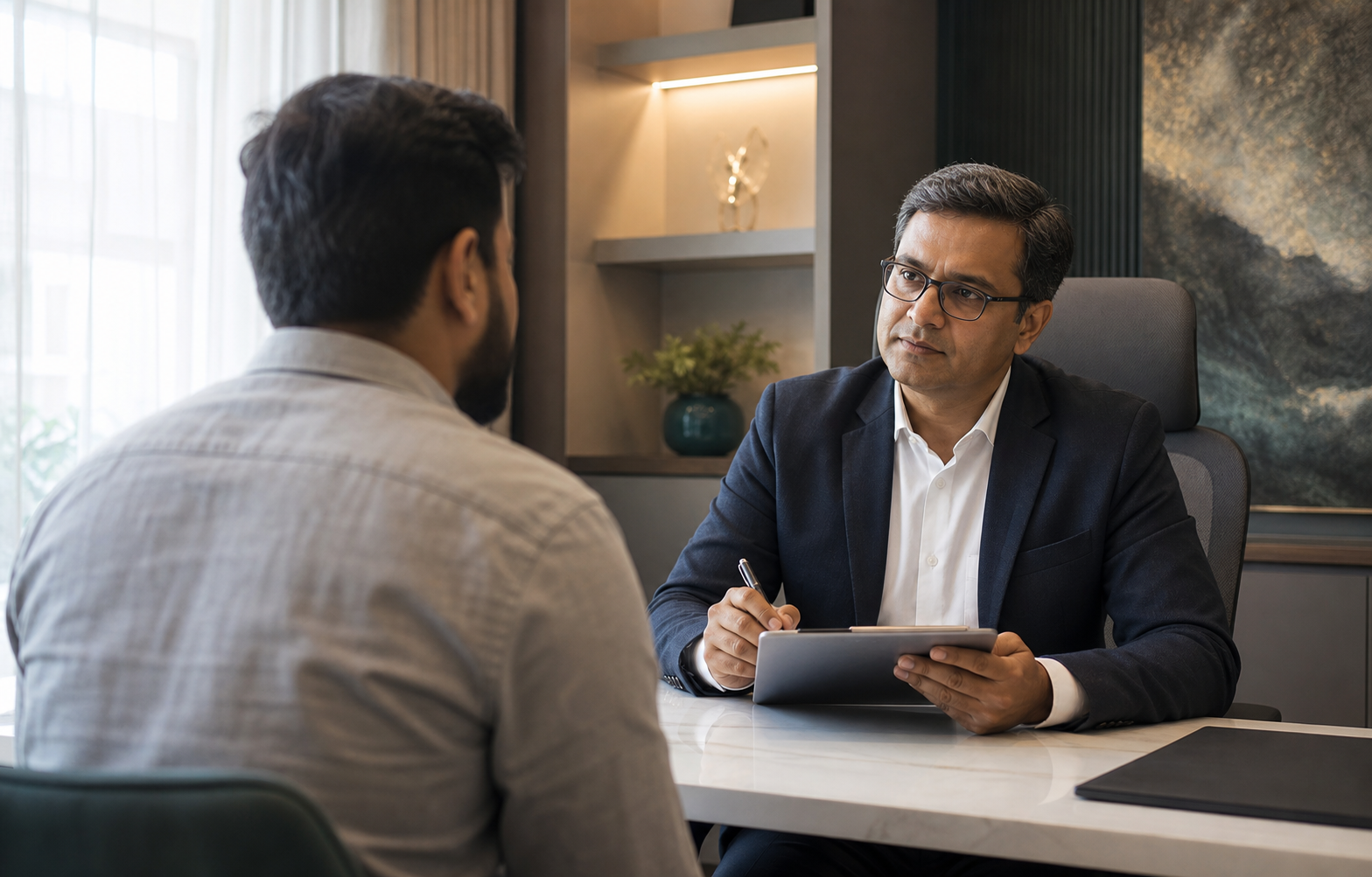 A private consultation between a surgeon and an adult male patient shown from behind
